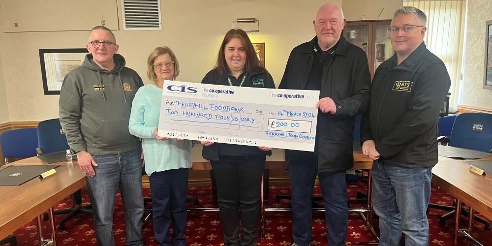 Councillors present cheque to foodbank