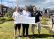 Councillor J Quinn presents cheque